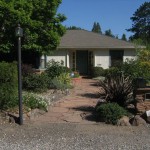 Inviting entry path with custom stone mail box