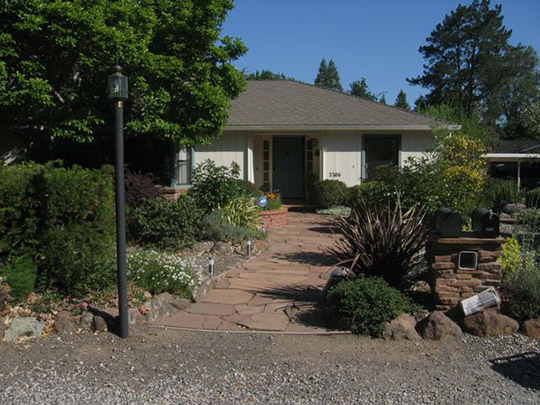 Inviting entry path with custom stone mail box